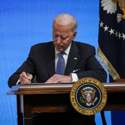 US President Joe Biden signs an executive order regarding American manufacturing on January 25, 2021. Photo: Getty Images/TNS