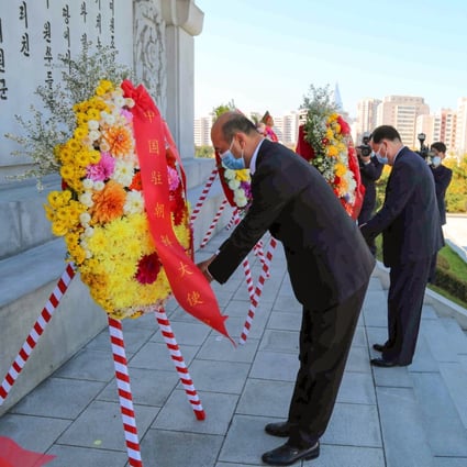 Sun Hongliang, chargé d’affaires of the Chinese embassy, and Kang Yun-seok, vice-chairman of the North Korean legislature’s standing committee, lay flowers at the Friendship Tower in Pyongyang on Tuesday. Photo: Chinese embassy in Pyongyang