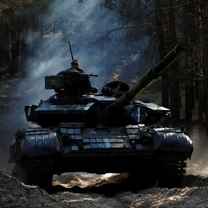 Ukrainian soldiers drive a captured Russian tank in the Kupiansk region of Kharkiv Oblast on October 15. Photo: Reuters