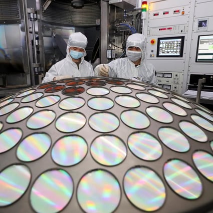 Employees work on the semiconductor chip production line of Jiangsu Azure Corp in Huaian, Jiangsu province. Photo: China Daily via Reuters