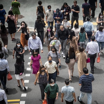 Pedestrians in Singapore’s central business district. Photo: Bloomberg