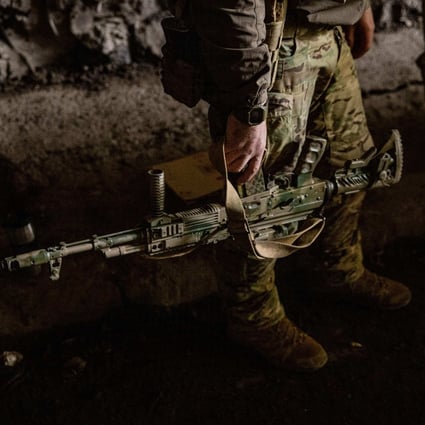 A Ukrainian soldier holds his assault rifle in the town of Bakhmut, in eastern Ukraine’s Donbas region. Photo: AFP