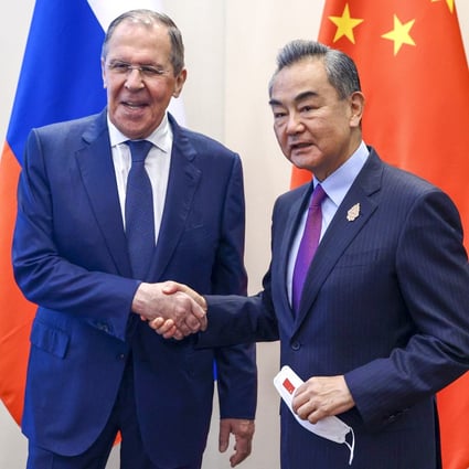 Chinese Foreign Minister Wang Yi (right) and Russia’s Sergey Lavrov meet ahead of a G20 event in Bali in July. Photo: EPA-EFE
