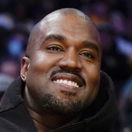 Kanye West watches an NBA game in Los Angeles in March. Photo: AP