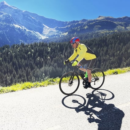 Steve Wartenberg cycles on the D4 road to the summit of the Col de la Colombiere, near the village of Le Reposoir, in the French Alps. Photo: AP