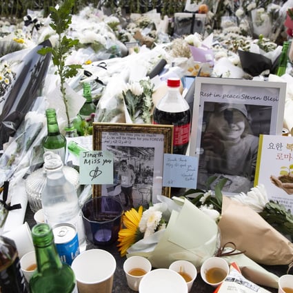 Flowers and pictures placed in tribute to victims of the Seoul Halloween stampede are seen on Tuesday. Photo: EPA-EFE