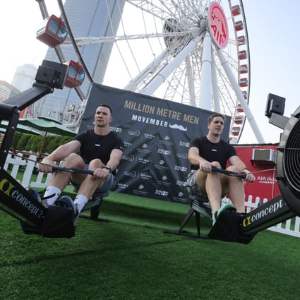Ben Cullen (left) and George Fleming begin their Million Metre Men rowing event challenge for Movember at the AIA Onservation Wheel in Hong Kong’s Central district. Photo: Jonathan Wong