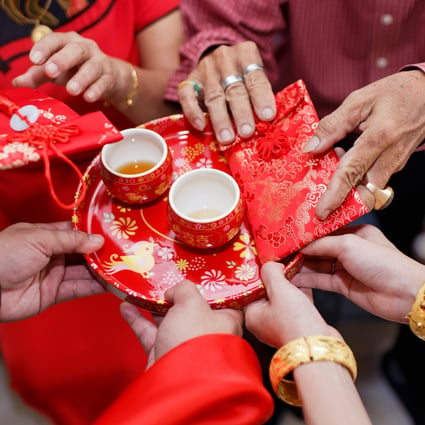 A couple holds lai see from elderly family members during a Chinese wedding. In August, Hong Kong’s Court of Appeal ruled that the city’s mini-constitution granted access to the institution of marriage only to opposite sex partners and that the government had no obligation to recognise same-sex unions. Shutterstock.