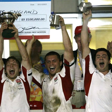 England’s Simon Amor, Henry Paul and Rob Thirlby celebrate their victory at the 2003 Sevens. Photo: Antony Dickson