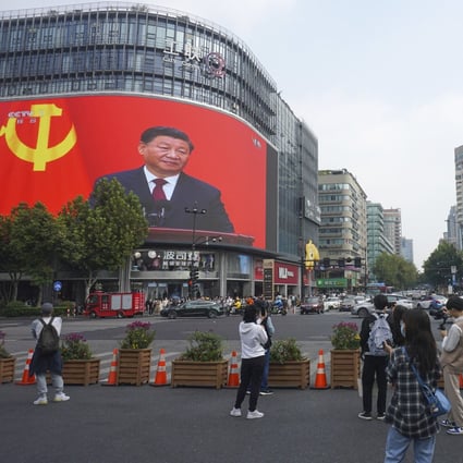 China’s leadership reshuffle under President Xi Jinping (pictured on screen) last month raised questions about the country’s economic policy moving forward. Photo: AP