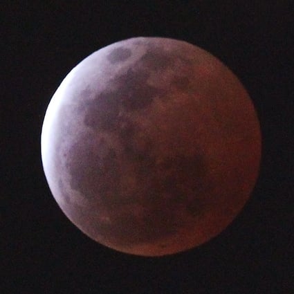 A “blood moon”, created by the full moon passing into the shadow of the earth during a total lunar eclipse, as seen from Tsim Sha Tsui. Hong Kong, on April 4, 2015. Photo: SCMP
