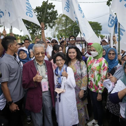 Malaysia’s former prime minister Mahathir Mohamad (centre left) with supporters after filing his nomination in Langkawi on Saturday. Photo: AP