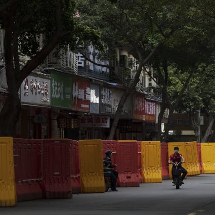 Shops barricaded as Covid-19 cases rise in Guangzhou, in south China’s Guangdong province. Photo: AP