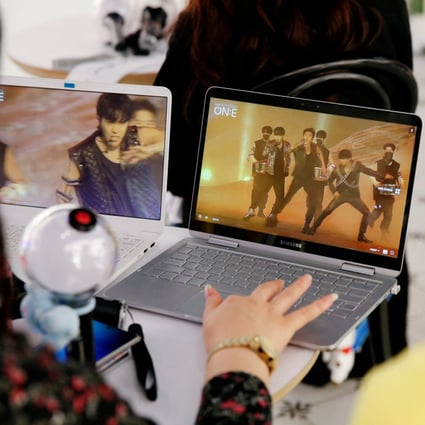 Fans of K-pop boy band BTS watch a live streaming online concert. Virtual concerts and streaming services became the norm during the pandemic – but which digital content changes will stay when Covid restrictions fully lift? Photo: Getty Images