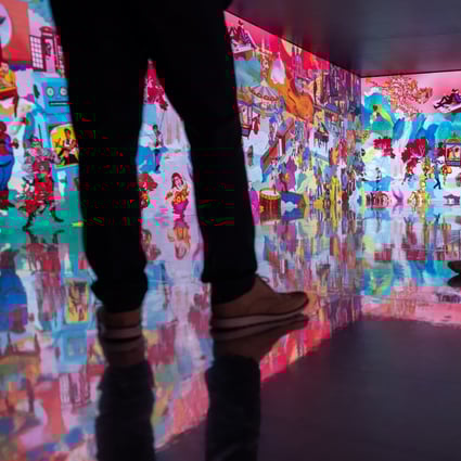 Visitors at the Digital Art Fair Xperience 2022 in Hong Kong, October 21, 2022. Photo: EPA-EFE