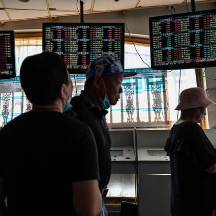 Investors monitor stock prices at a securities company in Shanghai in September 2021. Photo: AFP