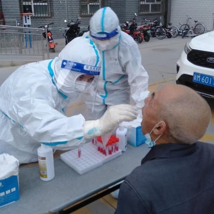 Health workers in Korla, the second largest city in China’s Xinjiang region, test a resident for Covid-19. Photo: Weibo