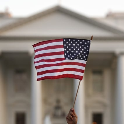A US flag is waved outside the White House in September 2017. Photo: AP