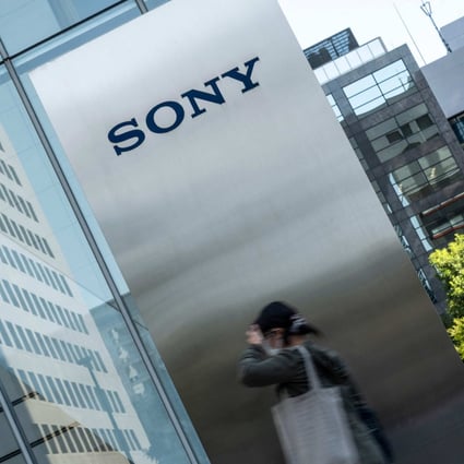 A woman is seen walking outside Sony Group's headquarters in Tokyo on  October 31, 2022. Photo: Agence France-Presse