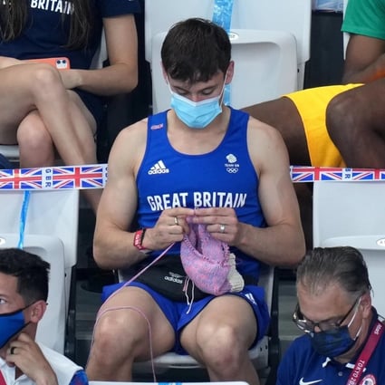 British diver Tom Daley knits at the Tokyo Olympics. His and other celebrities’ affinities with knitwear has caused it to surge in popularity recently. Photo: Getty Images