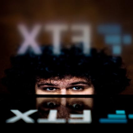 This photo illustration shows the logo of cryptocurrency FTX, reflected in an image of former chief executive Samuel Bankman-Fried, in Washington on November 13, 2022. Photo: AFP
