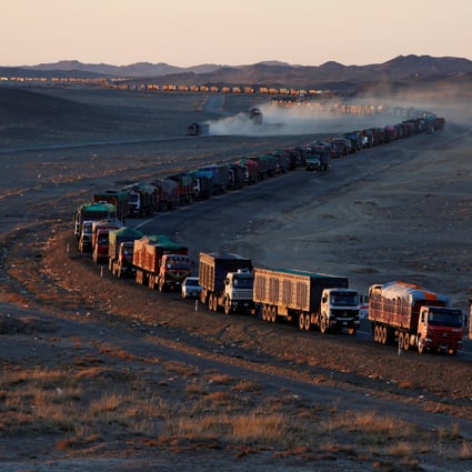 Thousands of heavy-duty trucks loaded with coal extending as long as 130 kilometres from the Mongolia-China border on a road in the Gobi desert. Photo: Reuters