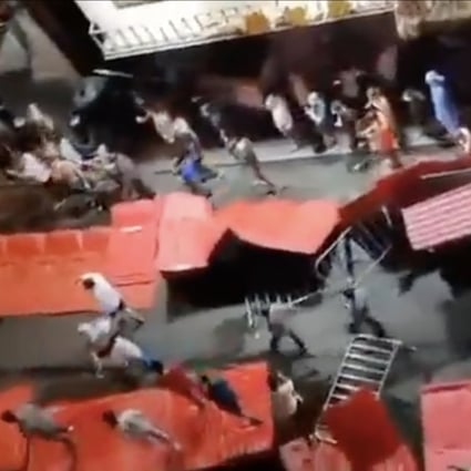 Videos circulating on social media on Monday showed Guangzhou residents breaking through lockdown barriers and breaching checkpoints. Photo: Twitter