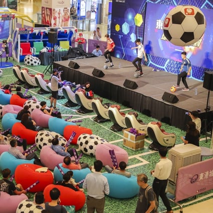 Fans watch a live broadcast of the first 2018 World Cup match at an event held at East Point City in Tseung Kwan O. Photo: K. Y. Cheng
