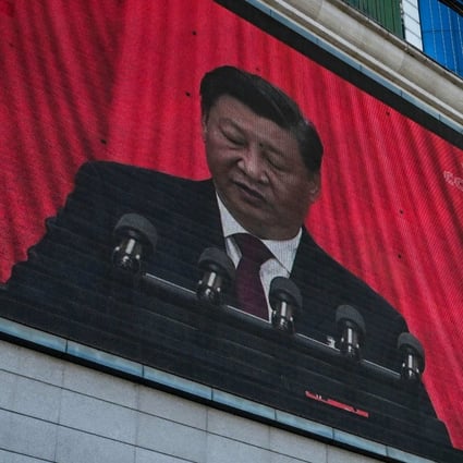 Xi Jinping is seen on a screen in Yan’an city, China, as he speaks at the 20th Chinese Communist Party Congress on October 16. Photo: AFP