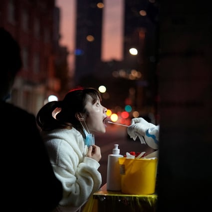 A woman gets tested for Covid-19 at a nucleic acid testing site in Shanghai on November 15. China is confronting its most severe outbreak in months, and easing controls will exacerbate the virus spread. How much tolerance Beijing has for a deterioration of conditions before it puts its foot back on the brake is difficult to tell. Photo: Reuters 