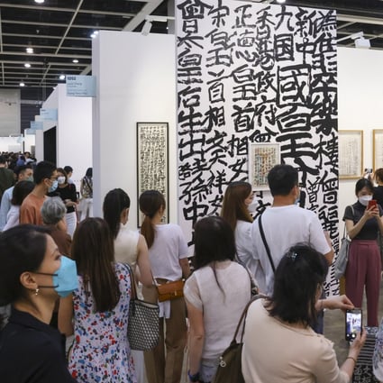 Visitors view graffiti calligraphy by Tsang Tsou-choi, the “King of Kowloon”, at Art Basel Hong Kong 2022. The 2023 fair will take place from March 21-25. Photo: Nora Tam