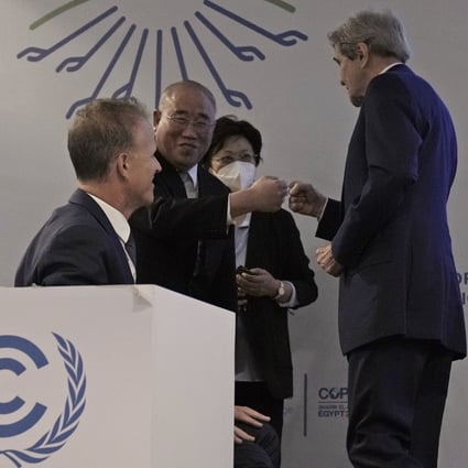 Xie Zhenhua and John Kerry greet each other at the COP27 UN Climate Summit, in Sharm el-Sheikh, Egypt. Photo: AP