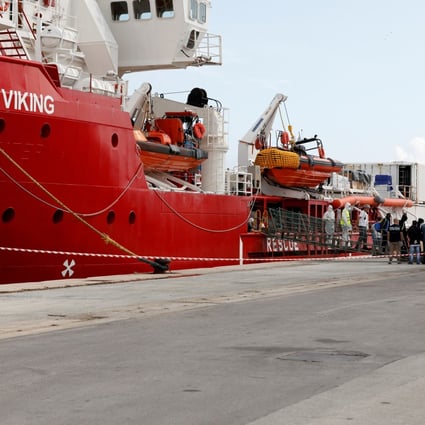 Migrants disembark at the port of Pozzallo on the island of Sicily, Italy on October 30 after spending nearly two weeks on board the Ocean Viking. Photo: Reuters