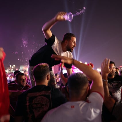 A fan seen with a beer in his hand at the opening of the Fifa fan festival at Al Bidda Park in Doha, Qatar. Photo: Reuters