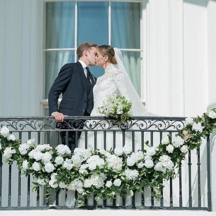 US President Joe Biden’s granddaughter Naomi Biden and Peter Neal kiss during their wedding at the White House on November 19. The bride wore a Ralph Lauren bridal gown for the ceremony, the first at the White House in nearly a decade. Photo: Instagram/@rafanellievents