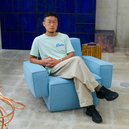 Korean designer Kwangho Lee sits in a lounge chair he made entirely from natural materials - wood, latex foam, cocomat (coconut fibre) and wool. Photo: Jihoon Kang