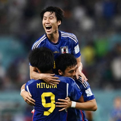 Japan’s Kaoru Mitoma, Wataru Endo and Daichi Kamada celebrate after beating Germany. Photo: Reuters