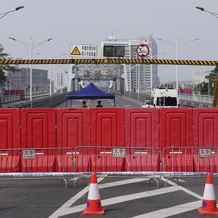 Barriers form a security checkpoint during a Covid-19 lockdown in Guangzhou’s Haizhu district on November 11. Photo: AP