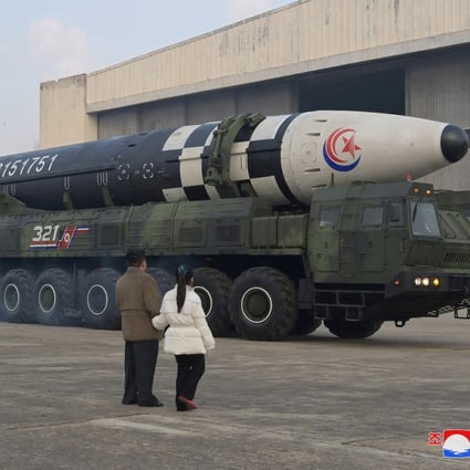 North Korean leader Kim Jong-un, along with his daughter, inspects an intercontinental ballistic missile (ICBM) on November 19. Photo: KCNA via Reuters