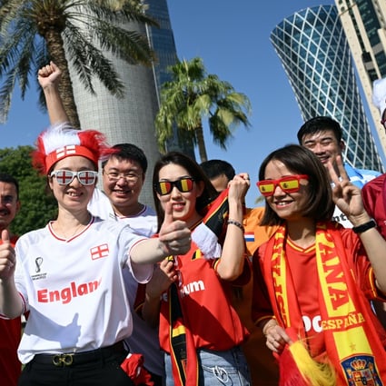 Chinese fans line up for a group photo in Doha. Photo: DPA