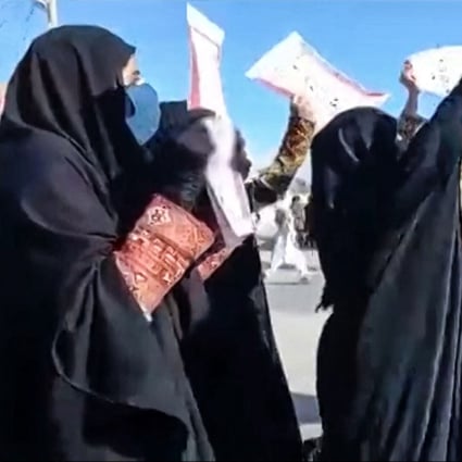 Women march with anti-regime placards in the city of Zahedan in Iran on November 25. Protests have been taking place for weeks, with hundreds of people killed, including dozens of children. Photo: Video screen grab via AFP