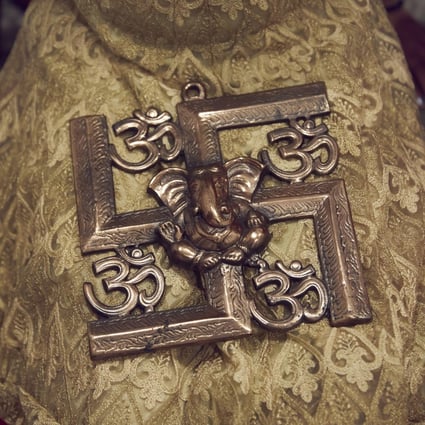 A Hindu swastika symbol is considered one of peace and prosperity. Photo: AP