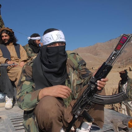 A Pakistan Taliban commander sits on an armed vehicle in Khyber Pakhtunkhwa province. Photo: AFP/File