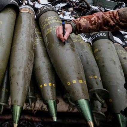 A Ukrainian service member writes a message to Russian troops on a shell for an M777 Howitzer at a front line in Donetsk region on November 23. Photo: Radio Free Europe/Radio Liberty via Reuters