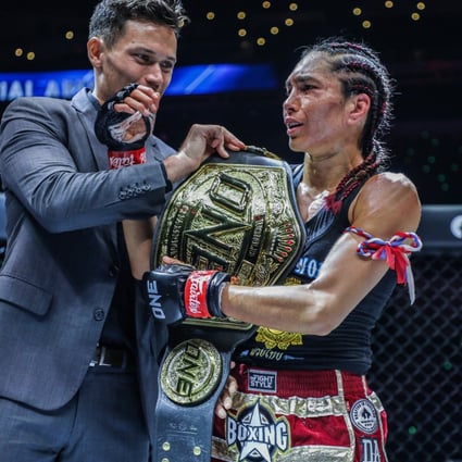 Janet Todd celebrates after winning the interim atomweight Muay Thai title at ONE 159 in Singapore. Photo: ONE Championship