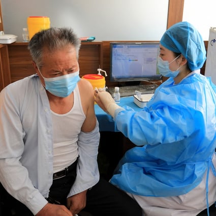 Some 68.7 per cent of people in mainland China aged over 60 have had three Covid-19 shots, and authorities want more to get vaccinated. Photo: AFP