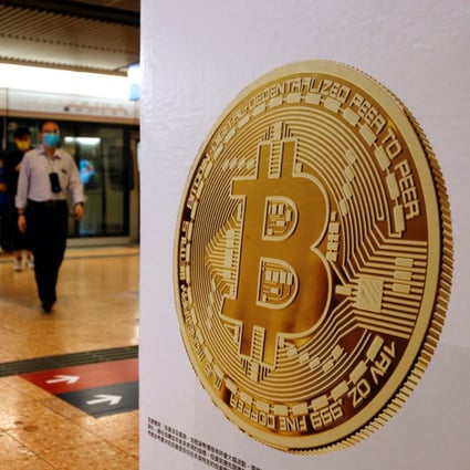 Advertisements for a crypto exchange show a Bitcoin symbol at a Mass Transit Railway station in Hong Kong in October 2021. Photo: Reuters