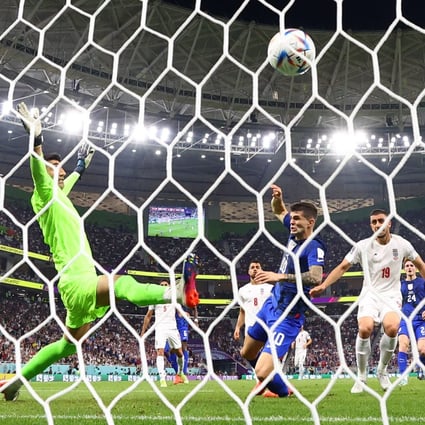 Christian Pulisic scores his side’s winner against Iran’s Photo: Reuters