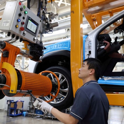 An employee works on the production line of Nio electric vehicles. Photo: China Daily via Reuters 

