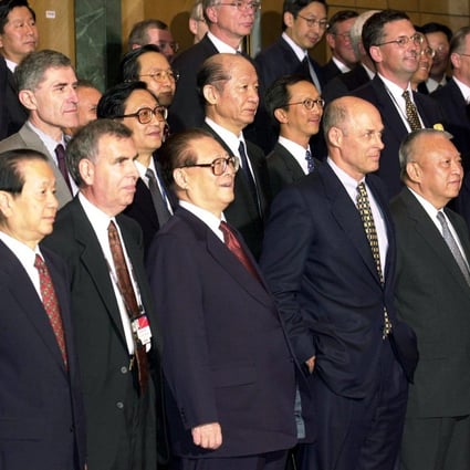 Then-president Jiang Zemin (front row, centre) and chief executive Tung Chee-hwa (front row, second from right) take part in a photo session with delegates at the Fortune Global Forum on May 8, 2001, at the Hong Kong Convention and Exhibition Centre. Photo: Handout